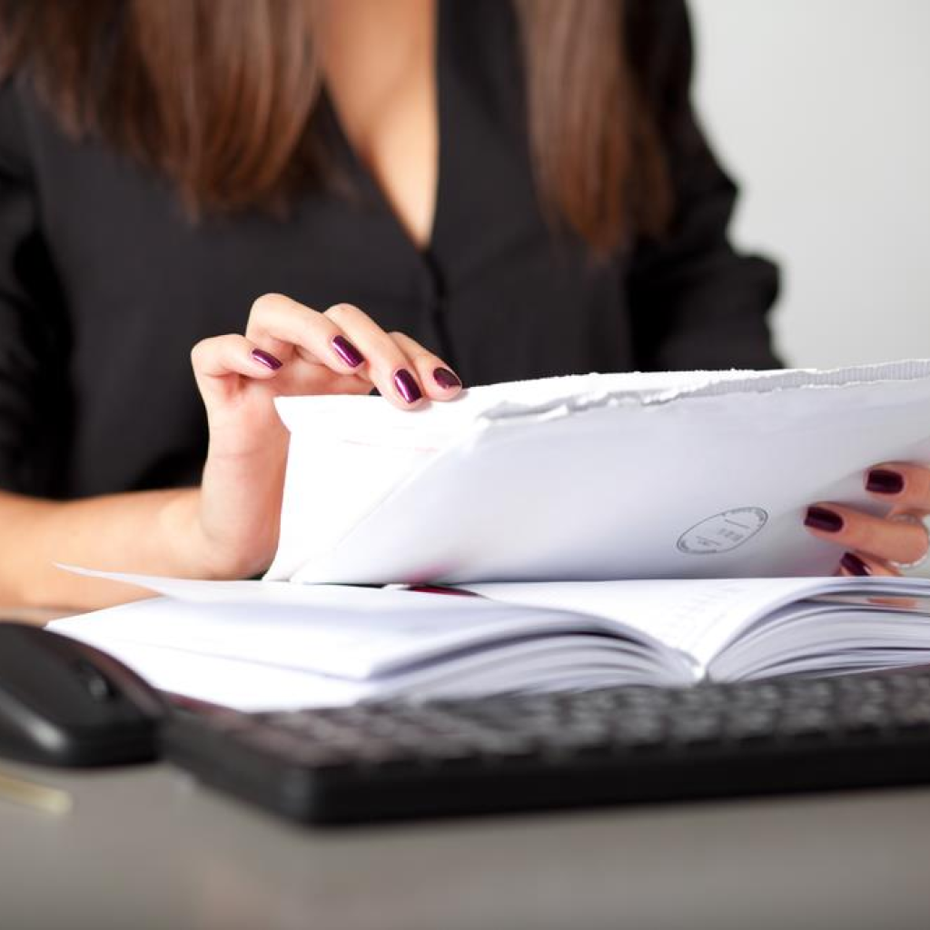 Startup founder opening mail as part of the services provided by a virtual office solution in Singapore.