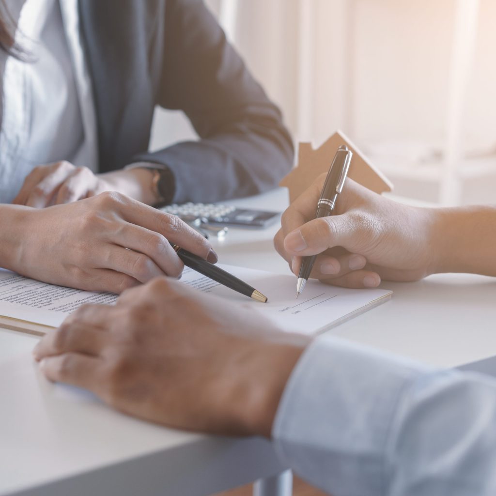 two people signing a lease contract of a serviced office in Singapore