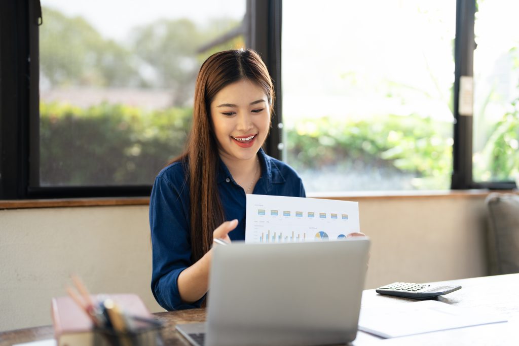 young woman doing work with her laptop in a flexible virtual office setup