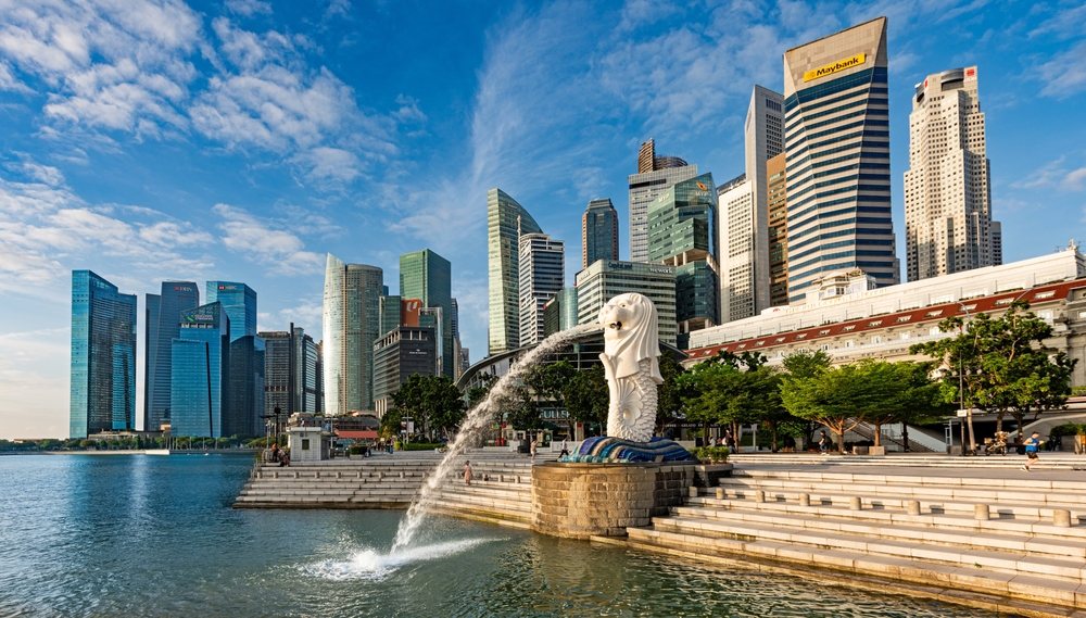 The Signapore Merlion in front of an urban landscape, providing a glimpse of Singapore, a market with which a virtual office solution in Singapore can target.